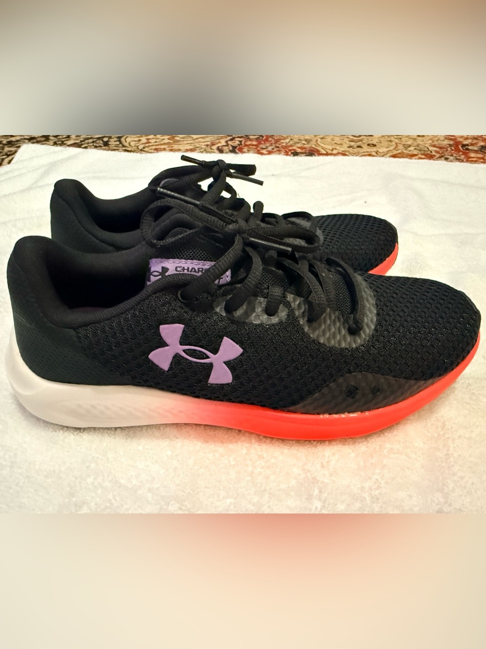 Size 7 Under Armour Women’s Black Running Shoes with Purple Logo and pink Sole